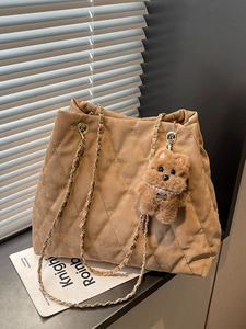 Large khaki quilted tote bag with chain strap and cute puppy pendant accessory