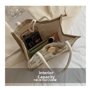 Detail view of large interior capacity showing bear jute bag with essentials inside