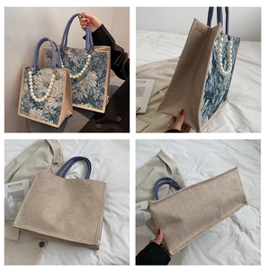 Detail of vintage linen tote with floral print, pearl chain, and dual size options