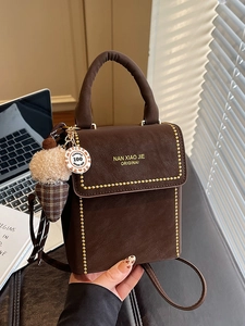 Chic brown synthetic leather handbag with gold bead trim and ice cream charm accessory