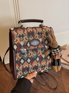Retro geometric woven crossbody bag with leather trim and cute rabbit doll charm