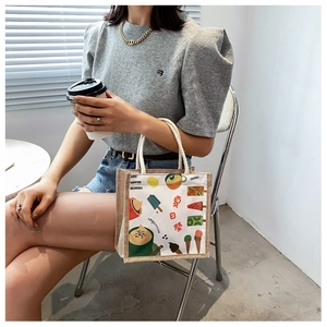 Close-up of summer festival canvas tote bag with cute ice cream and fruit illustrations