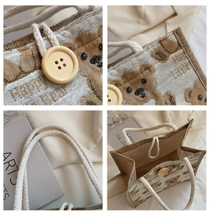 Detail view of linen tote bag with cartoon bear prints and wooden button closure