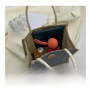 Internal view of linen tote bag showing space for tablet, umbrella and drinks