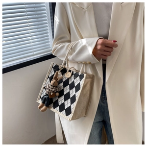Linen tote with argyle pattern, wooden button closure, and a cute rabbit doll charm