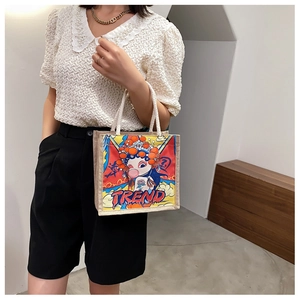 Detail of canvas tote bag featuring rope handles and artistic girl print in trend style