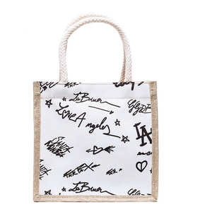 Minimalist canvas tote bag with graffiti prints and woven cotton rope handles for women