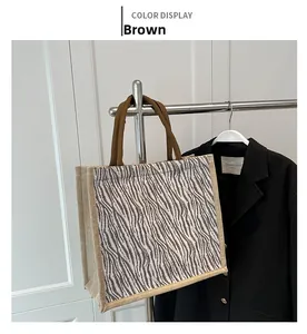 Detail of linen tote bag showing coffee abstract patterns and textured fabric weave