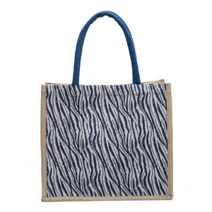 Retro linen tote bag featuring zebra pattern and blue rope handles on white background