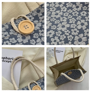 Detail view of floral linen handbag with wooden buckle and woven rope handle