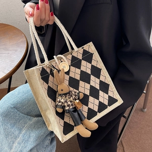 Linen canvas tote bag with black diamond pattern and cute plush bunny charm