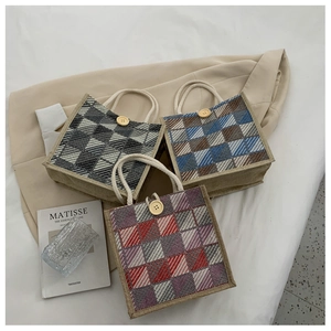 Detailed view of mini plaid canvas bags with wooden buttons and thick hemp rope handles