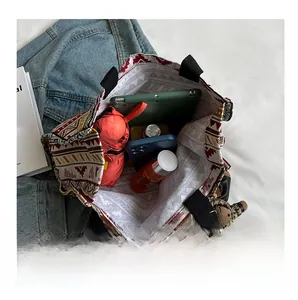 Internal view of ethnic canvas tote bag showing large capacity for tablet and daily items