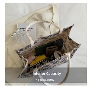 Macro view of patterned canvas tote bag showing interior capacity and magnetic closure