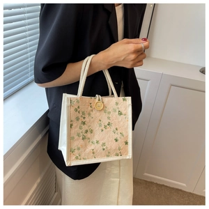 Lace lunch bag featuring floral embroidery, vintage wooden button and woven handles