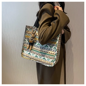 Ethnic style large canvas tote bag featuring geometric patterns and a plush rabbit charm