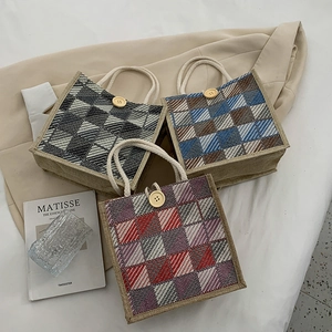 Fashionable checkered canvas tote bag with hemp rope handles and wooden button detail