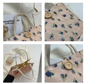 Detail of floral lace handbag featuring a vintage wooden button and woven rope handle