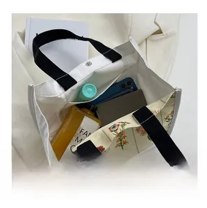 Interior view of floral canvas tote bag showing large capacity for daily essentials