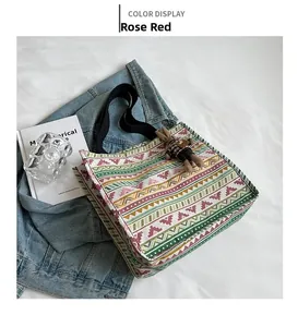 Ethnic canvas tote bag with rose red geometric patterns and a cute rabbit doll pendant