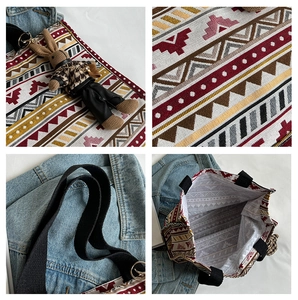 Detail of ethnic geometric patchwork tote with rabbit charm and woven texture