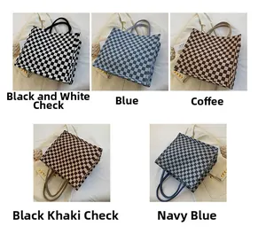 Detailed view of woven checkerboard tote bag collection in five elegant color options