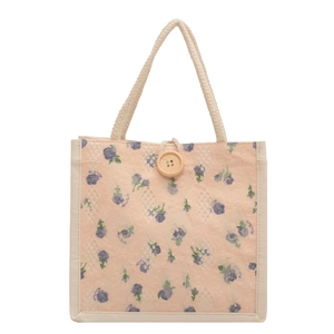Lace lunch bag with purple floral pattern, pink lining and rustic wooden button