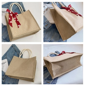 Detailed close-up showing texture and pattern of a high-capacity linen tote bag with scarf