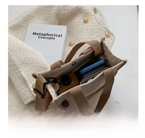 Detail view of large interior capacity for the beige canvas tote with adjustable strap
