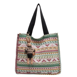 Ethnic geometric canvas tote bag with multi-color patterns and cute bunny charm pendant