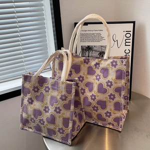 Stylish large and small tote bags with purple heart patterns and durable woven texture