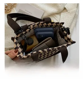 Top view showing large capacity for phones and wallet in houndstooth canvas tote bag