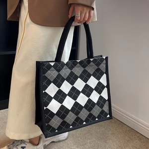 Classic argyle canvas tote bag with black and grey patterns and durable webbed handles