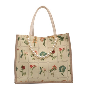 Floral print canvas tote bag with pearl chain decoration on white background