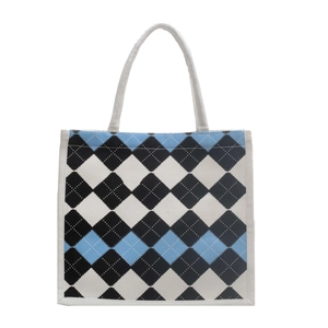Classic argyle canvas tote bag with blue and black patterns for daily college commuting
