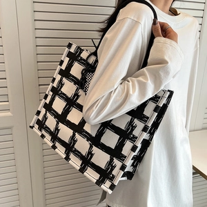 Modern black and white checkered canvas tote bag with large capacity for commuting