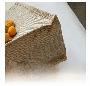 Detailed close-up showing reinforced stitching and natural linen texture of lunch bag