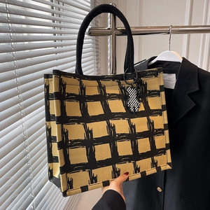 Large capacity canvas tote bag in yellow and black check pattern with bear charm