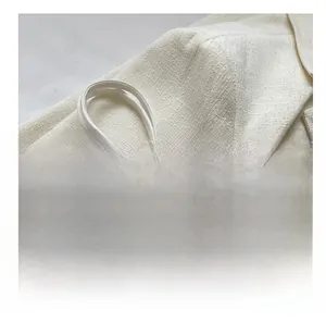 Detail view of the blue floral jacquard fabric and soft white braided rope handle