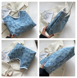 Detail shots of light blue floral canvas tote bag with textured fabric and white trim