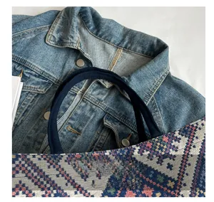 Detail of comfortable braided rope handle and geometric woven pattern on a large tote bag