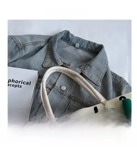 Detail of the woven rope handle and thick canvas fabric with bold number printing