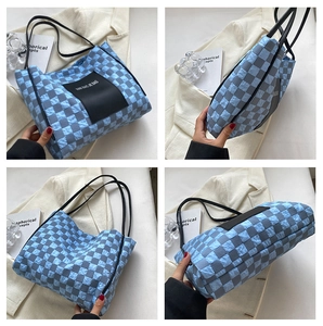 Detailed views of a blue checkered quilted puffer tote bag with black shoulder straps