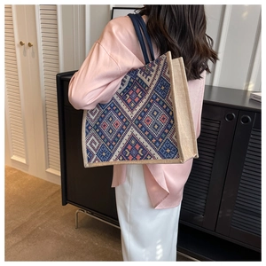 Macro shot of ethnic geometric woven pattern on large canvas commuter tote bag