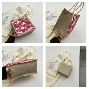 Macro details of mini jute tote bag featuring red heart patterns and rope handles