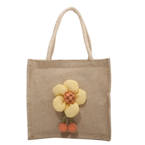 Cute linen lunch tote bag with large yellow fabric flower and woven rope handles