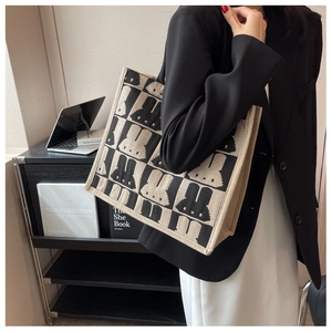 Large canvas tote bag with pixel rabbit pattern showing spacious design for daily commute