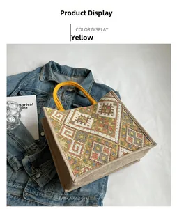 Close-up of ethnic geometric embroidery on large yellow jute tote bag for daily commute