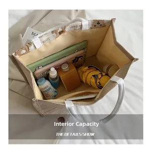 Spacious interior of canvas tote bag showing tablet, umbrella and daily essentials