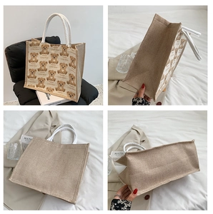 Detail view of canvas tote bag with Happy Little Bear prints and cotton rope handles